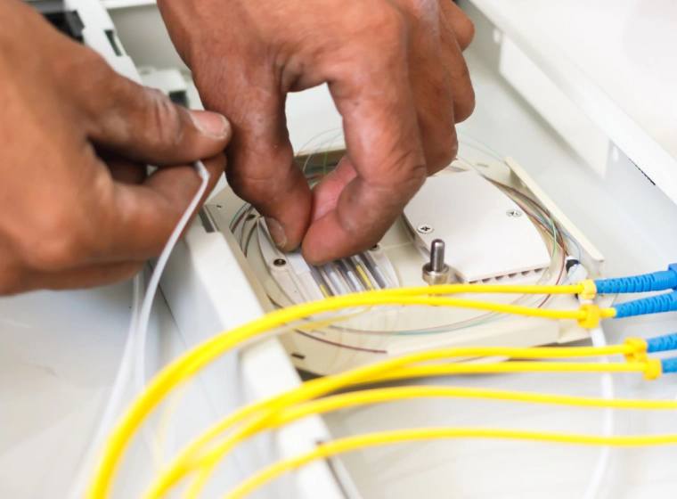 A man installing a Fiber Optic network